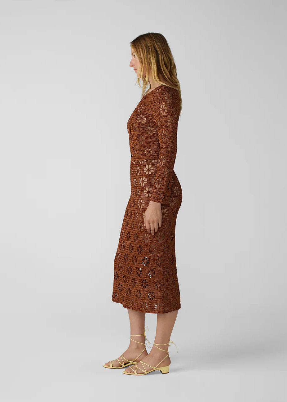 person wearing calle del mar womens viscose knit Floral Crochet Cardigan and skirt set in Suede