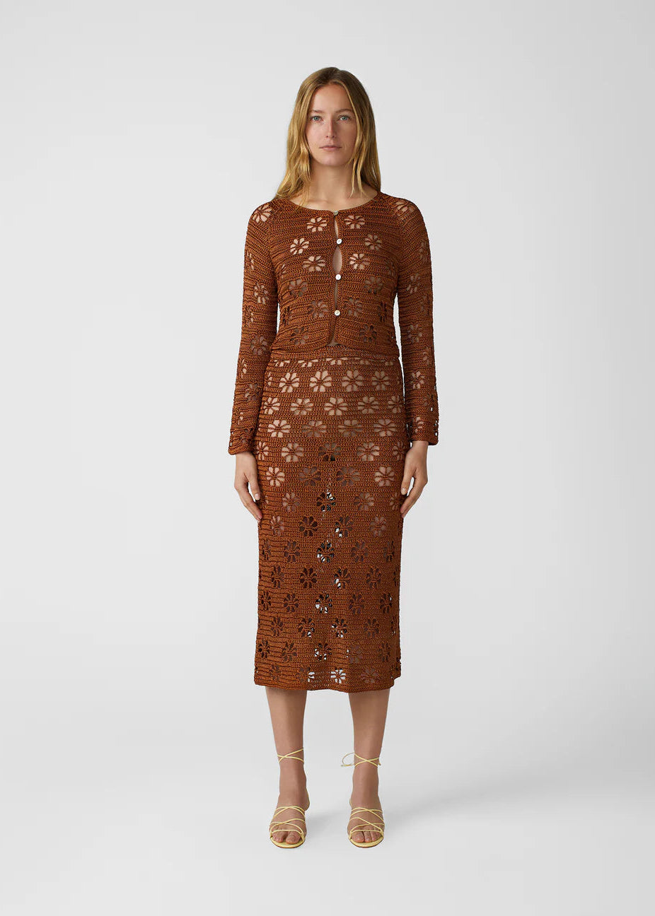 person wearing calle del mar womens viscose knit Floral Crochet Cardigan and skirt set in Suede