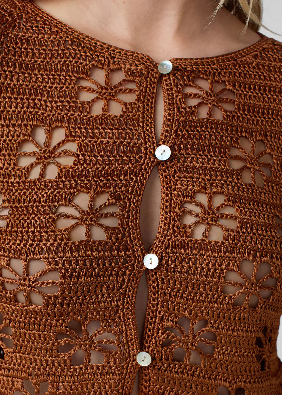 person wearing calle del mar womens viscose knit Floral Crochet Cardigan in Suede