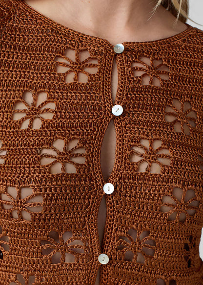 person wearing calle del mar womens viscose knit Floral Crochet Cardigan in Suede