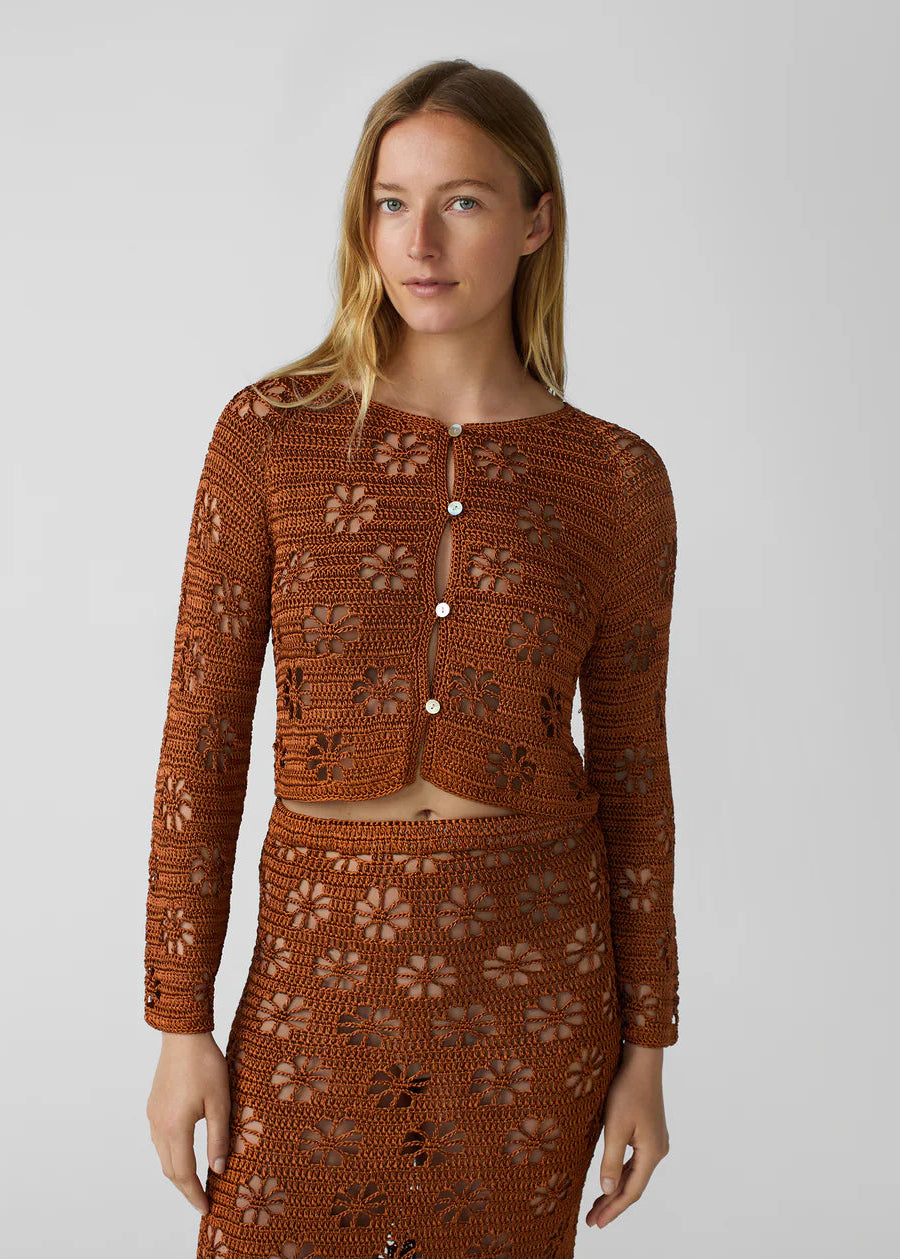 person wearing calle del mar womens viscose knit Floral Crochet Cardigan in Suede