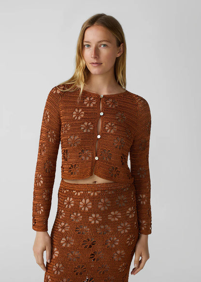 person wearing calle del mar womens viscose knit Floral Crochet Cardigan in Suede