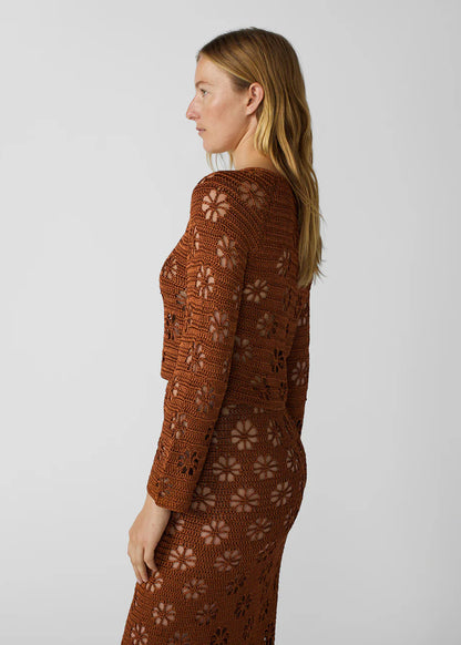 person wearing calle del mar womens viscose knit Floral Crochet Cardigan in Suede