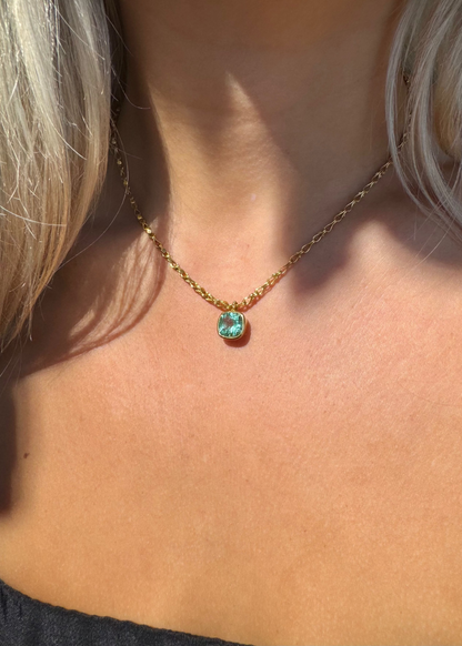 person wearing camille beinhorn fine jewelry 22k yellow gold One-of-a-Kind Emerald Bezel Pendant Necklace