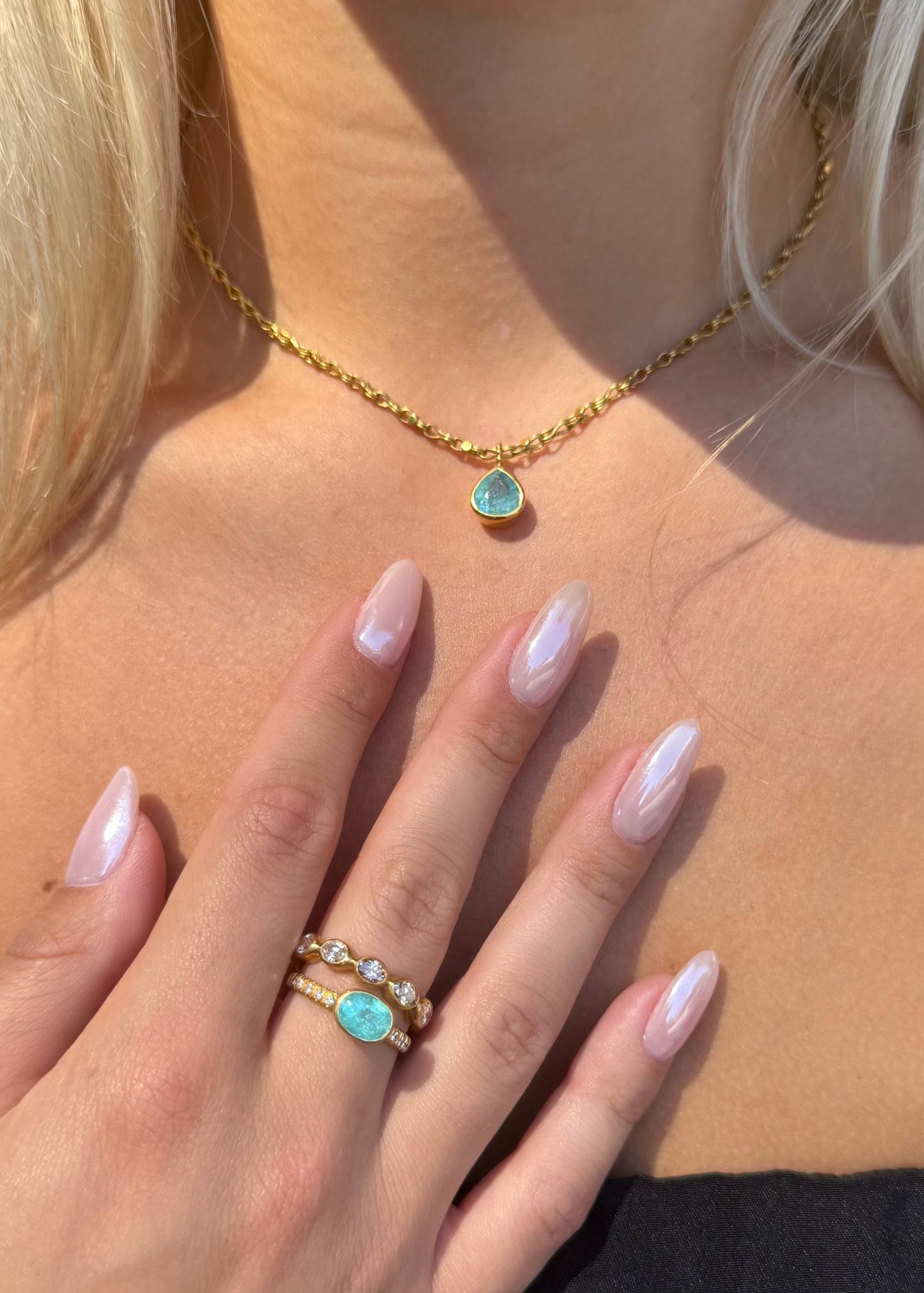 person wearing camille beinhorn fine jewelry 22k yellow gold champagne diamond Infiniti eternity Band Handwoven Chain Necklace One-of-a-Kind Paraiba Tourmaline Bezel Pendant one of a kind pariaba tourmaline bezel ring
