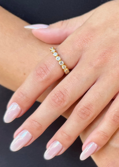 person wearing camille beinhorn fine jewelry 22k yellow gold old mine cut diamond Infiniti eternity Band