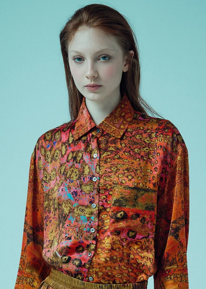 person wearing carmen molina womens printed silk Button Down Boyfriend Shirt pink leopard