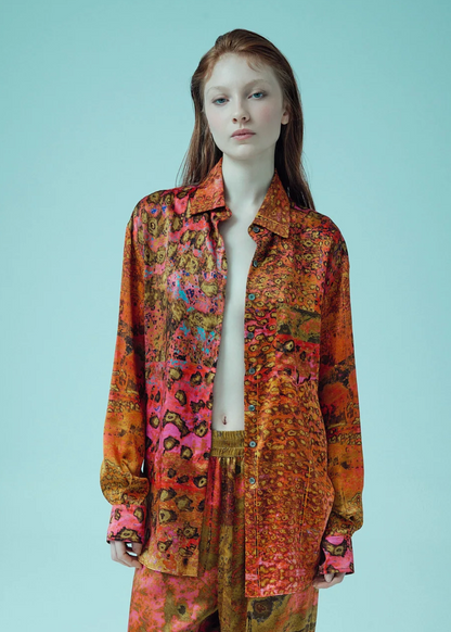 person wearing carmen molina womens printed silk Button Down Boyfriend Shirt pink leopard