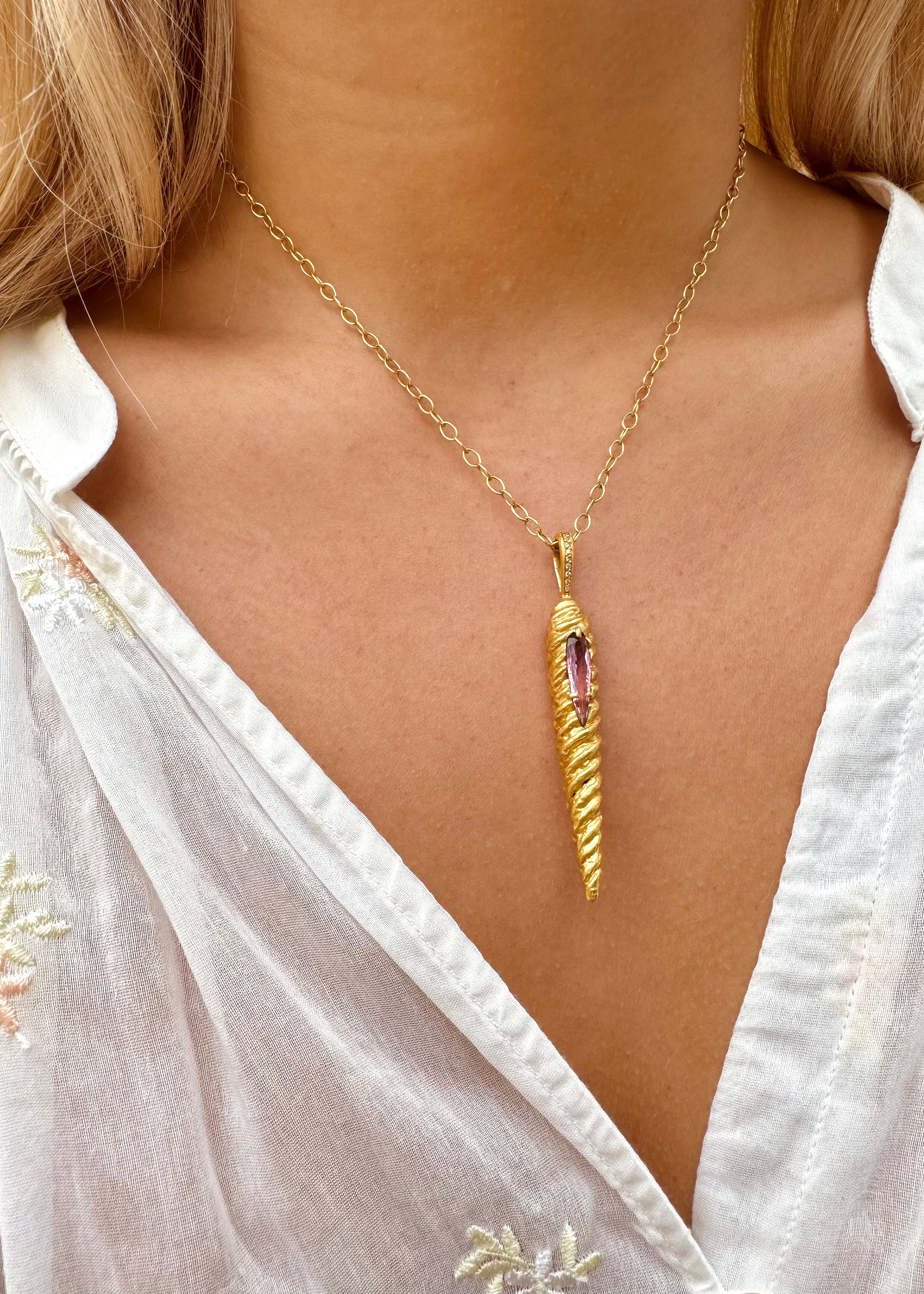 person wearing cathy waterman 22k yellow gold Magic Wand Charm with Pink Tourmaline on lacy chain