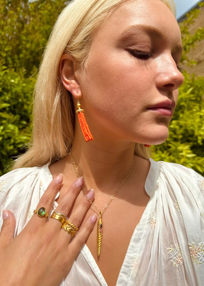 person wearing cathy waterman fine jewelry 22k yellow gold Coral Tassel Earrings