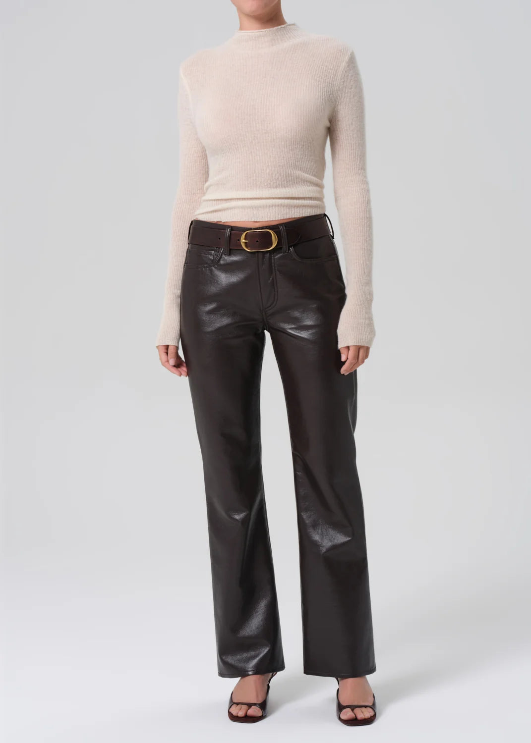 person wearing citizens of humanity womens Genova Low Rise Bootcut in Chocolate leather pant