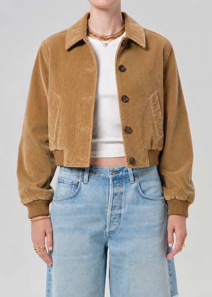 person wearing citizens of humanity womens Lola Eve Bomber Jacket amber tan corduroy