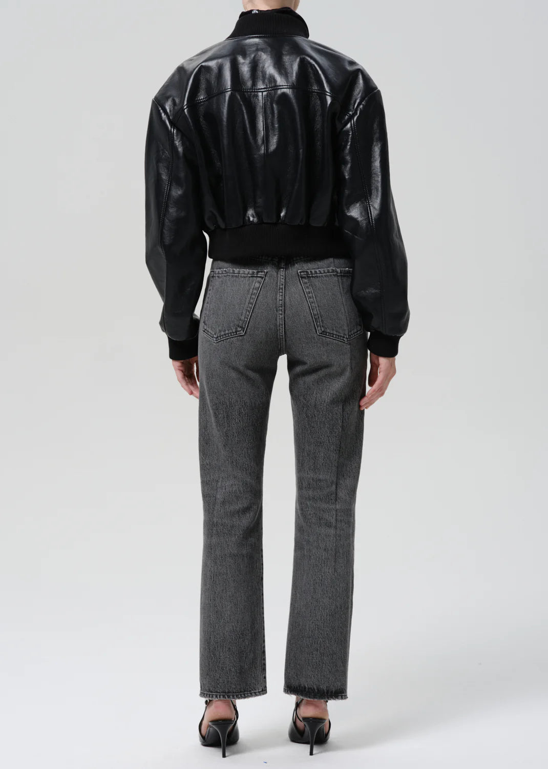 person wearing citizens of humanity womens denim 90's French High Rise Straight Jeans In Lumiere