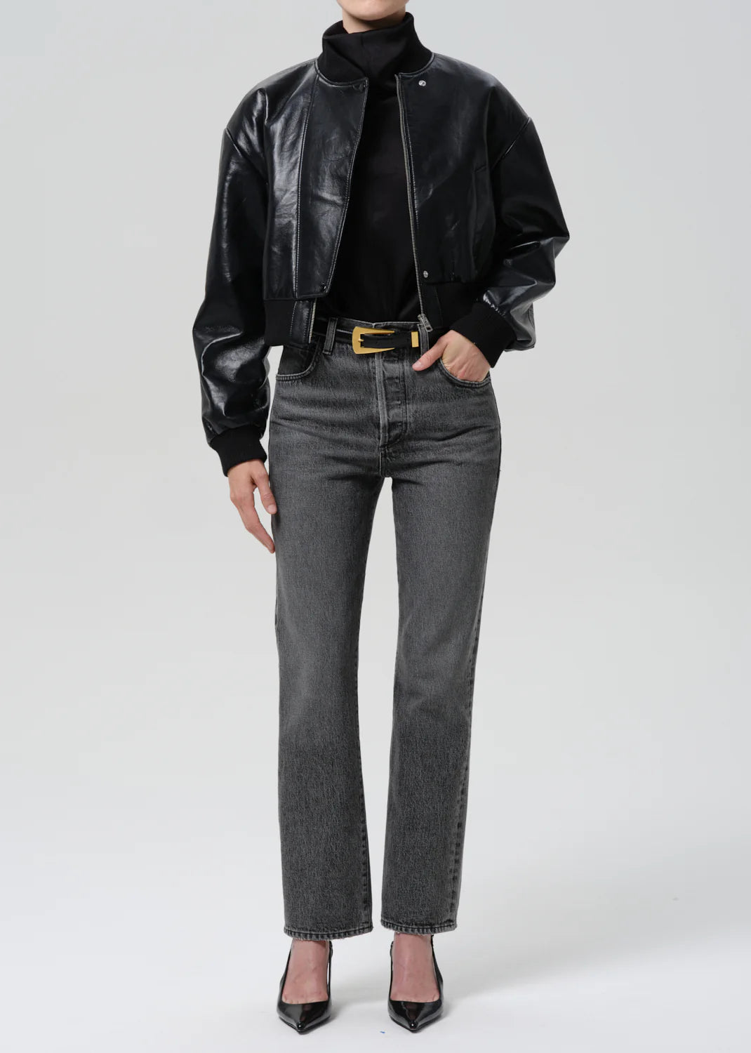 person wearing citizens of humanity womens denim 90's French High Rise Straight Jeans In Lumiere