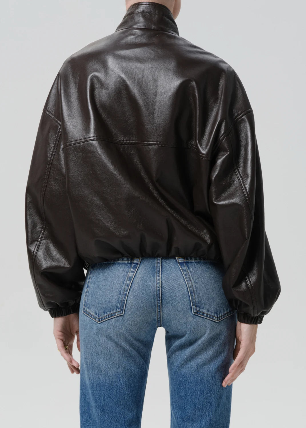 person wearing citizens of humanity womens leather Barracuta Bubble Jacket In Chocolate Dark Brown
