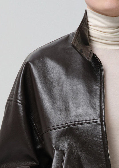 person wearing citizens of humanity womens leather Barracuta Bubble Jacket In Chocolate Dark Brown