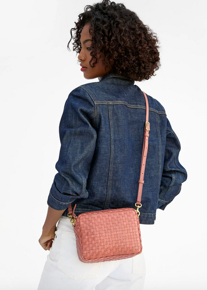 person wearing clare v womens Midi Sac in Rose Clay Woven Checker crossbody bag