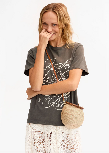 person wearing clare v womens petite Straw Pot De Miel Bag in Cream