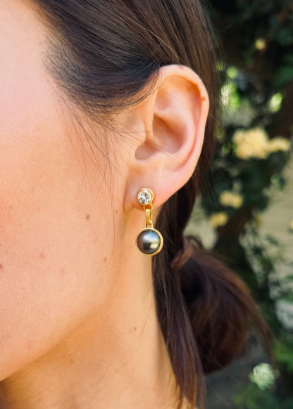 person wearing darius fine jewelry 18k yellow gold One-of-a-Kind Old Mine Cut Diamond & Tahitian Pearl Gem Drop Earrings