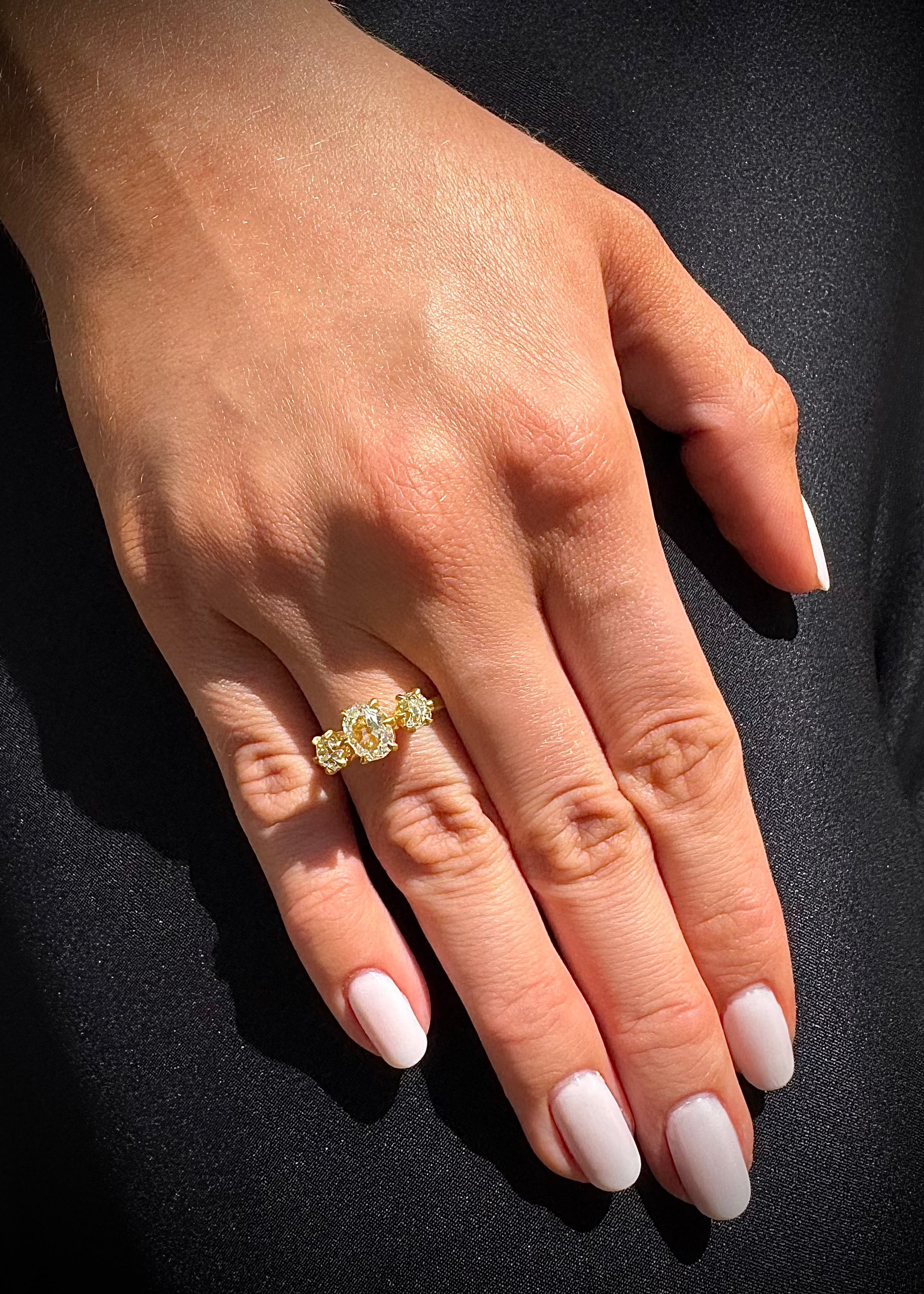 person wearing darius fine jewelry 18k yellow gold One-of-a-Kind Old Mine Cut Diamond Triple Claw Gem Fairy Band