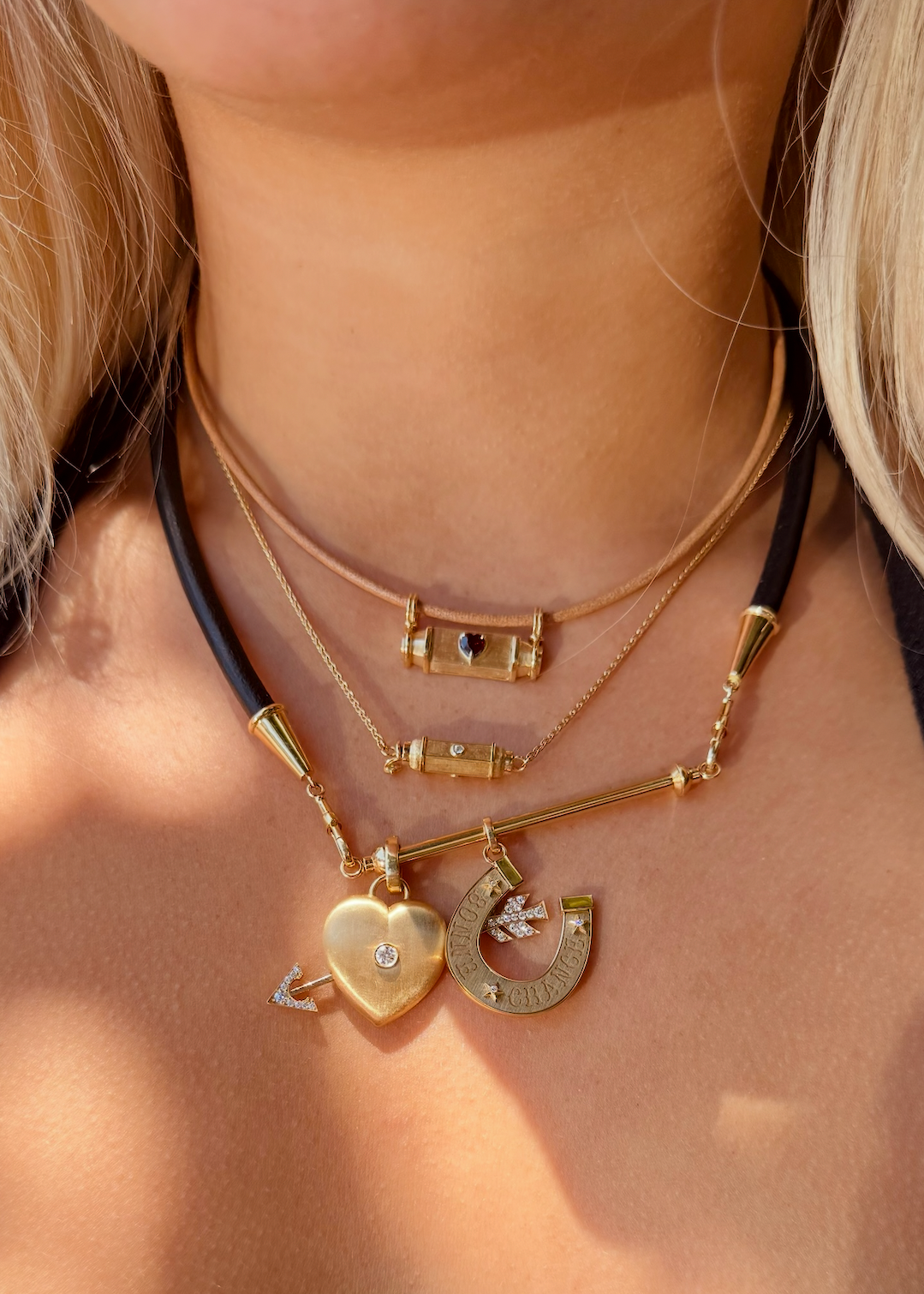 person wearing fine jewelry marie lichtenberg 18k yellow gold necklaces