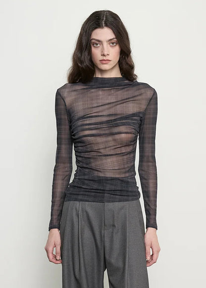 person wearing enza costa Shadow Plaid Mesh Long Sleeve Twist Top