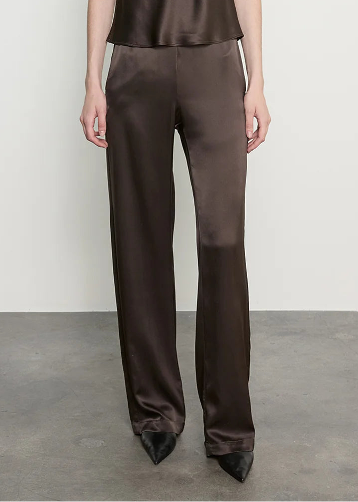 person wearing enza costa Silk Satin Everywhere Pant in Olive Bronze