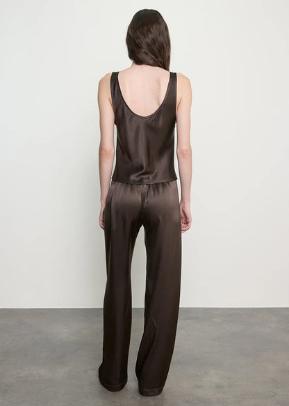 person wearing enza costa Silk Satin Everywhere Pant in Olive Bronze