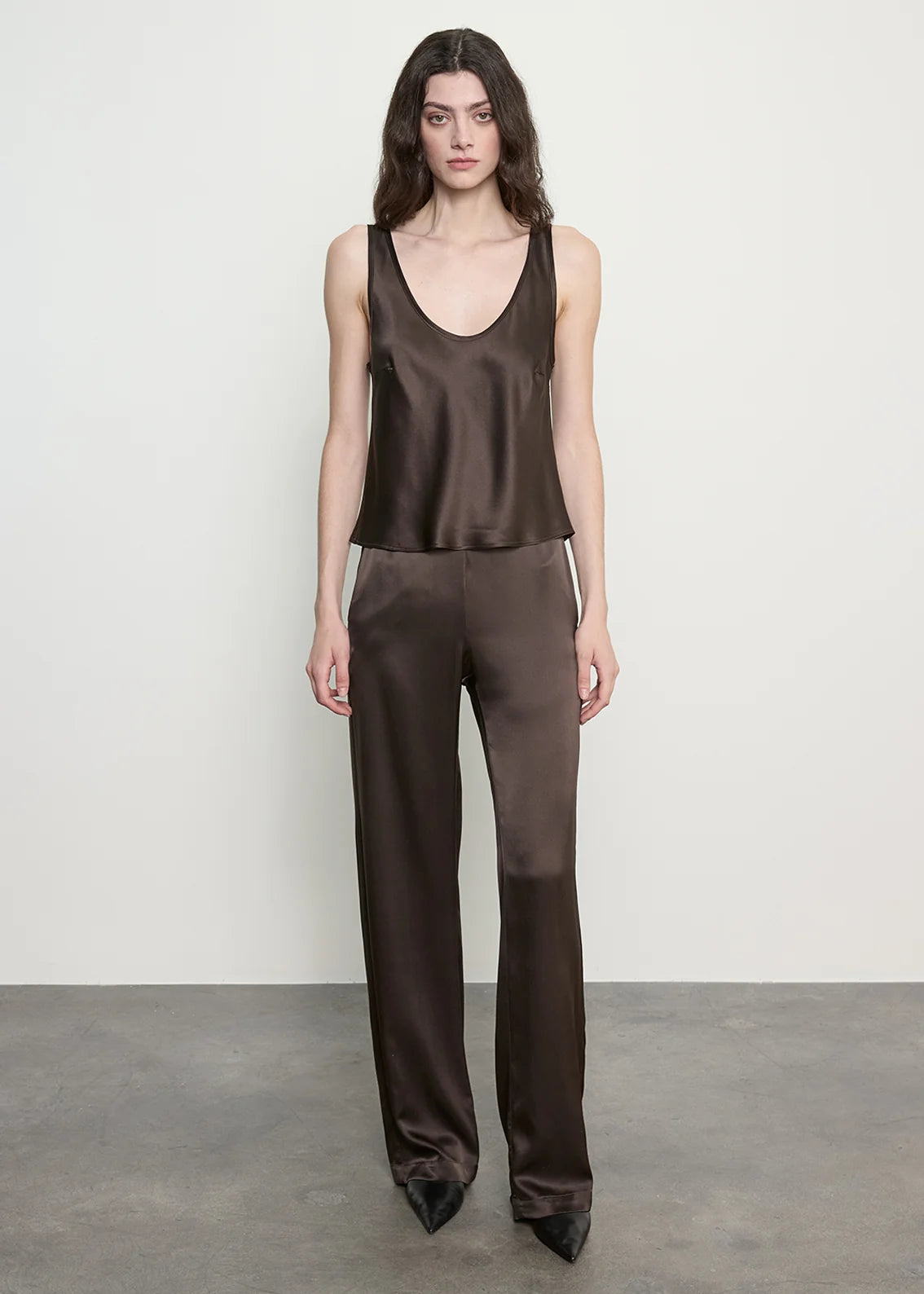 person wearing enza costa Silk Satin Everywhere Pant in Olive Bronze
