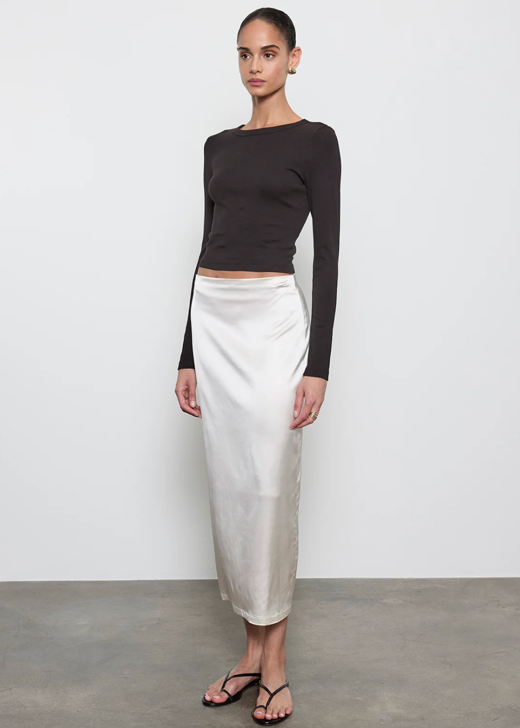 person wearing enza costa Supima Baby Rib Long Sleeve Cropped Top in Black