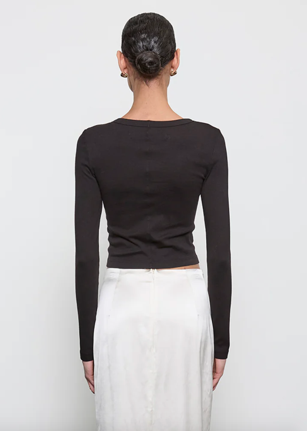 person wearing enza costa Supima Baby Rib Long Sleeve Cropped Top in Black