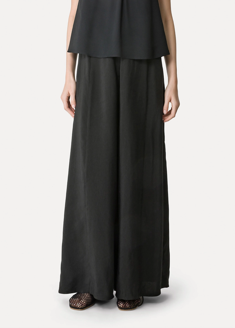 person wearing forte forte Linen and Viscose Flared Trousers 14817