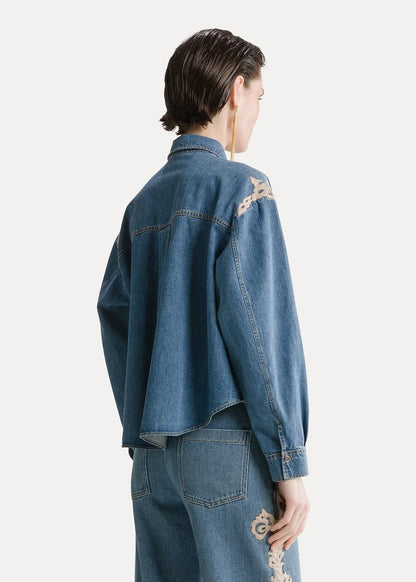 person wearing forte forte womens Embroidered Indigo Twill Boxy Shirt celeste wash denim