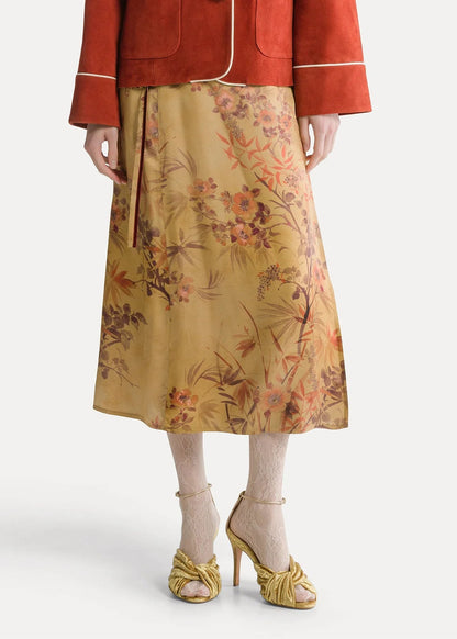 person wearing forte forte womens Le Bambou Secret Printed Satin Sarong Skirt