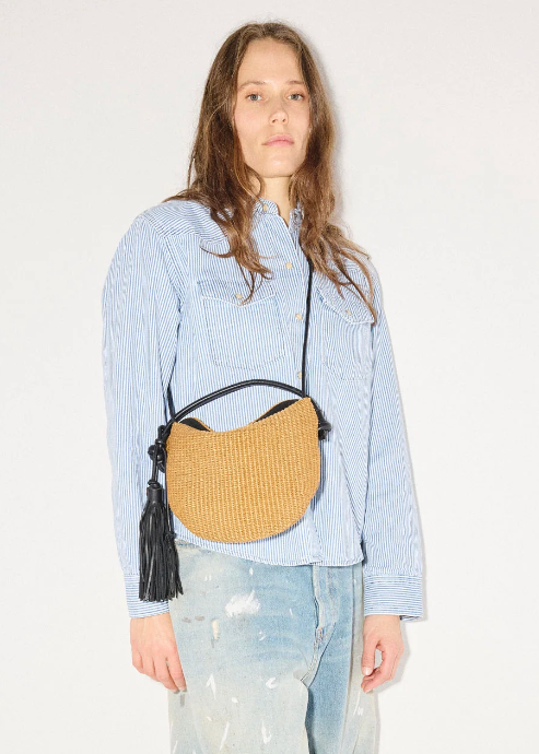 person wearing freda salvador Elis Mini Crescent Bag in Biscuit Raffia