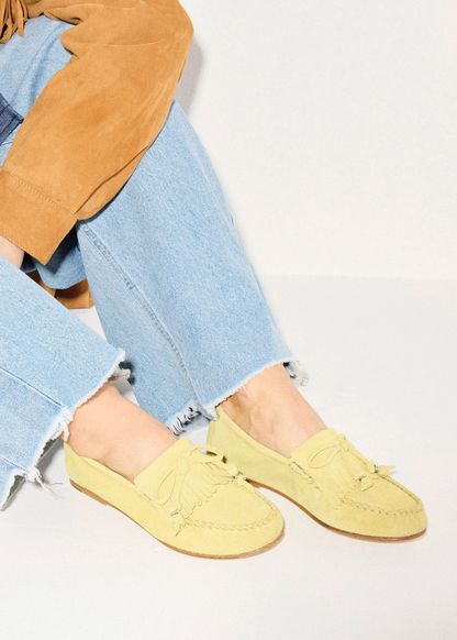 person wearing freda salvador womens Celeste Fringe Loafer in Citrus Suede
