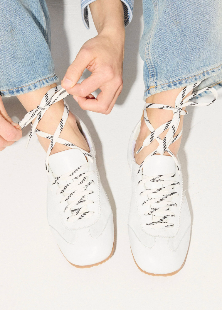 person wearing freda salvador womens Minnie Ballet Sneakers in milk calf combo