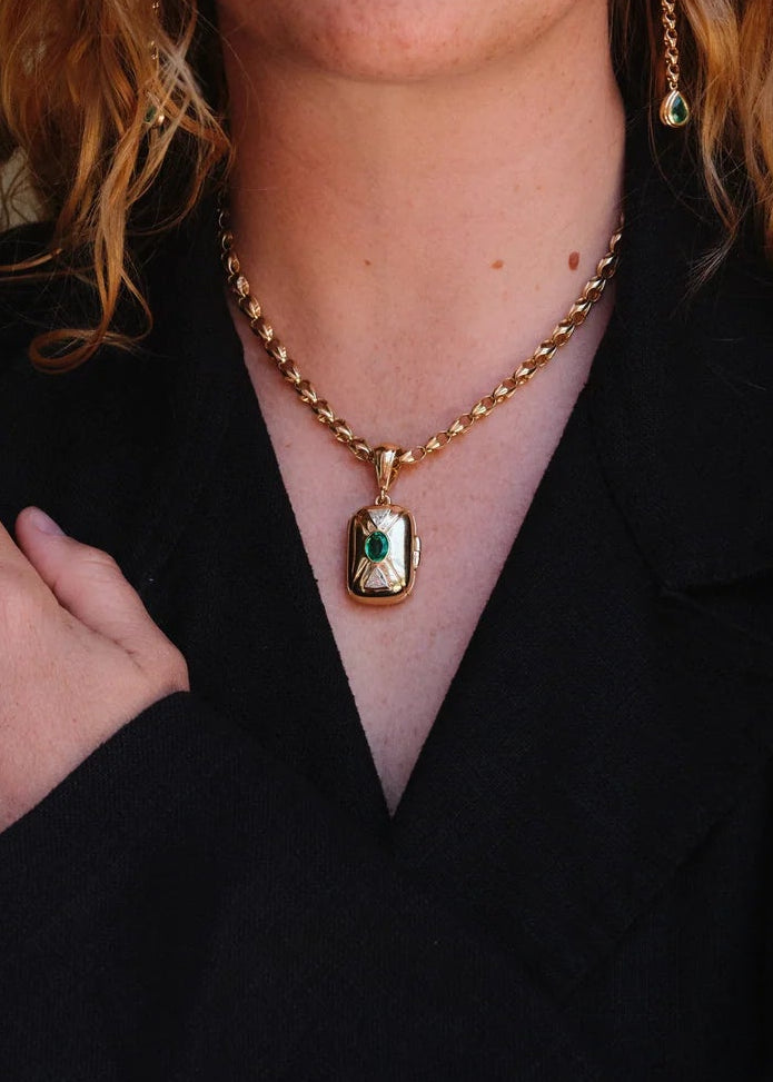 person wearing howl fine jewelry 18k yellow gold diamonds Lotus Mini Link Necklace Raleigh Emerald & Diamond Locket