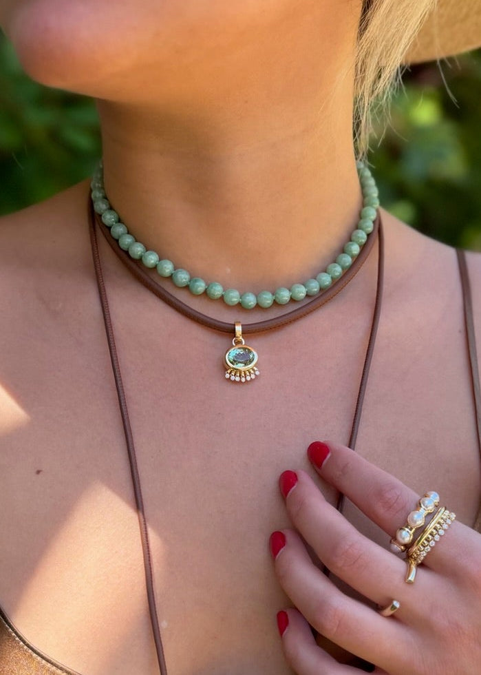 person wearing jade ruzzo fine jewelry 18k yellow gold