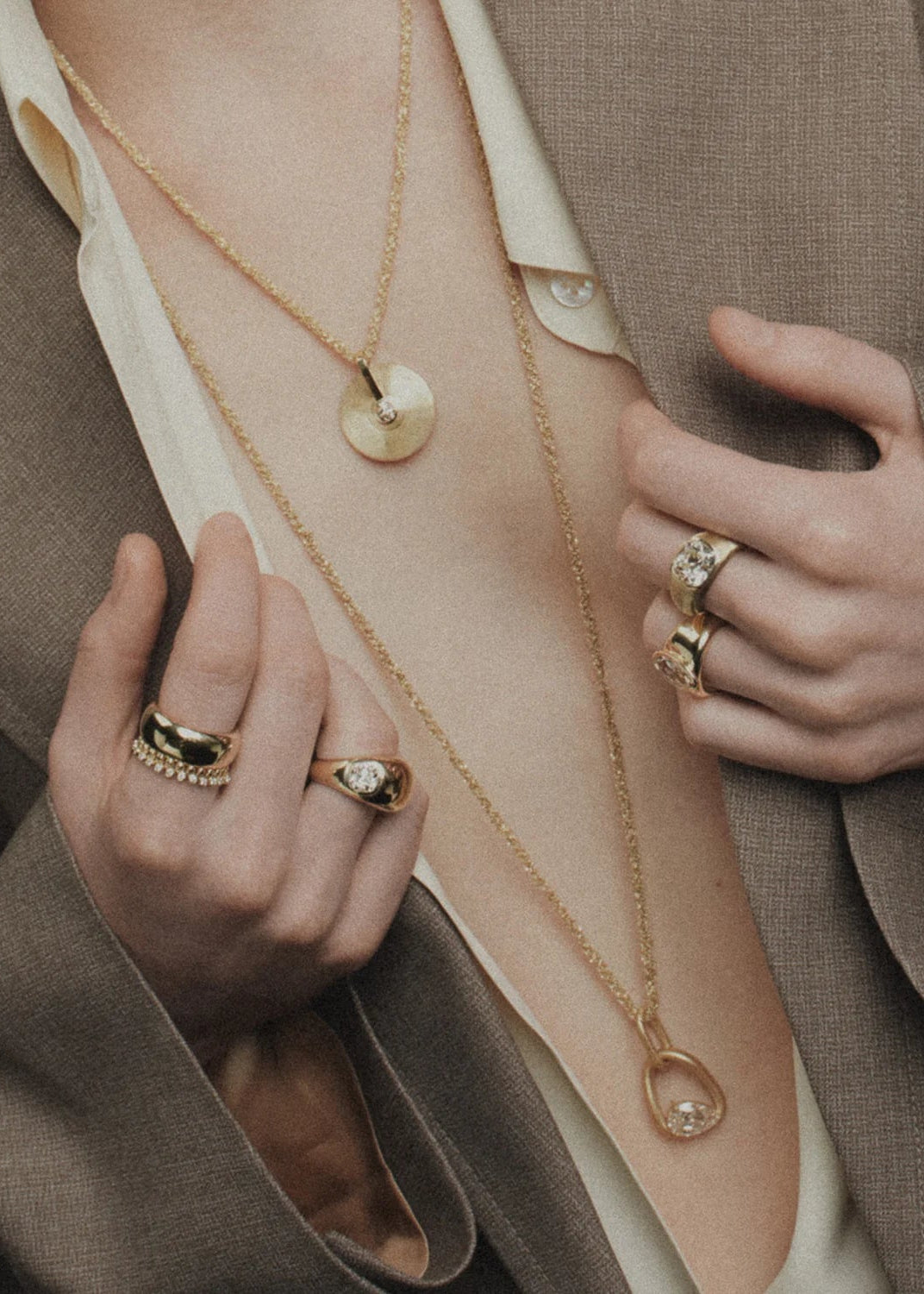 person wearing jade ruzzo fine jewelry  qchains rings pendants