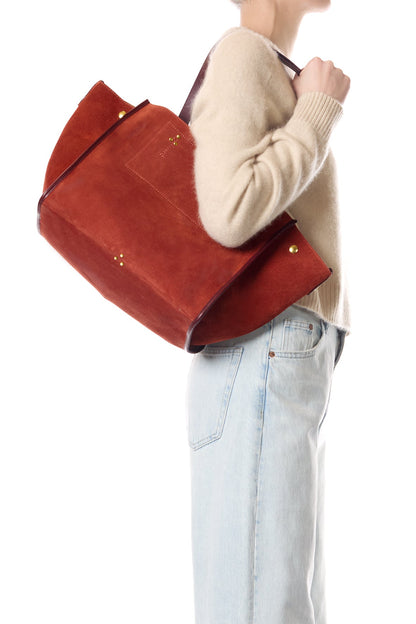 person wearing jerome dreyfuss womens Léon M Suede Tote in Rouille rust