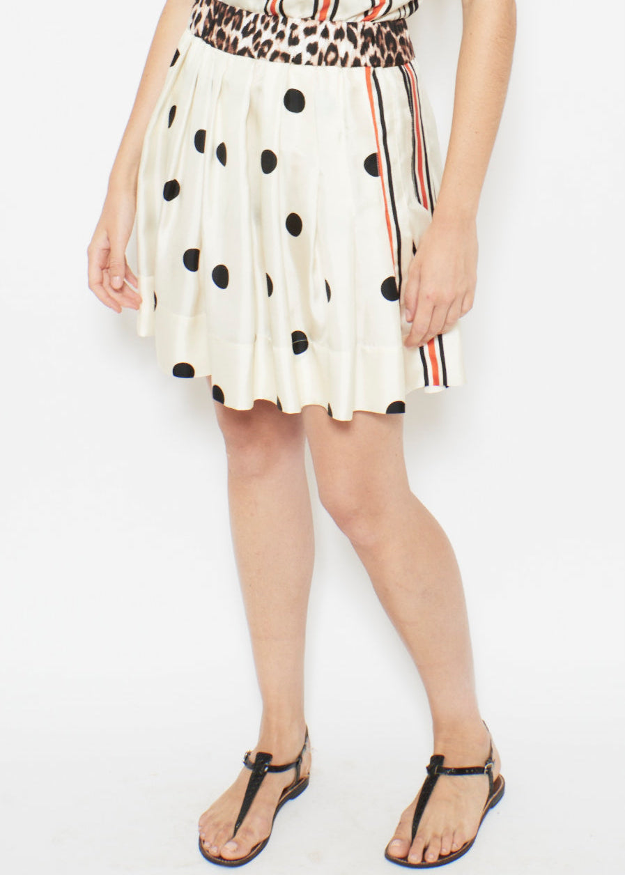 person wearing la prestic ouiston womens silk Ischia Skirt in Polka Dot & Stripe Mix reversible