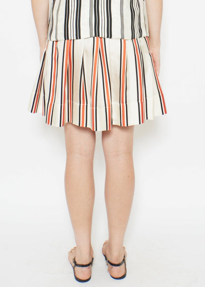 person wearing la prestic ouiston womens silk Ischia Skirt in Polka Dot & Stripe Mix reversible