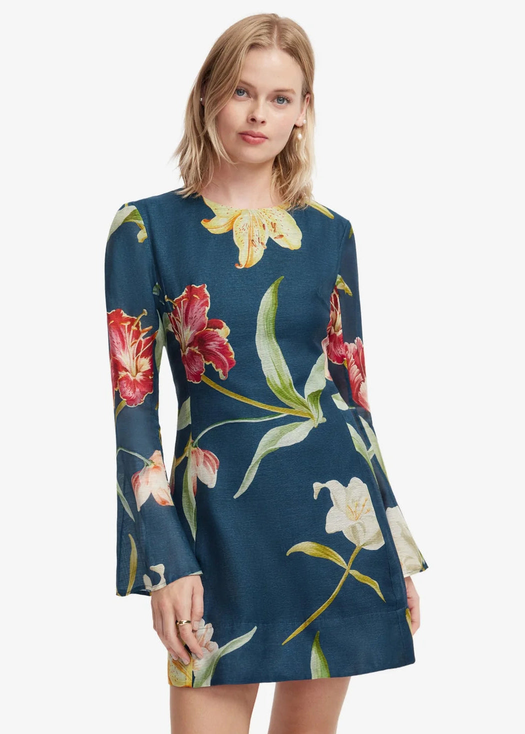 person wearing leo lin womens Suzanne Bell Sleeve Lily Print Mini Dress in Indigo