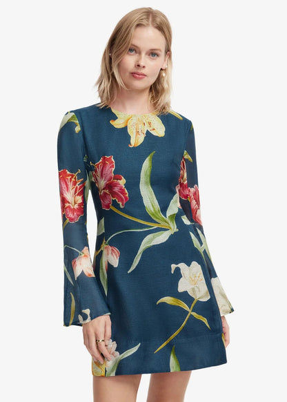 person wearing leo lin womens Suzanne Bell Sleeve Lily Print Mini Dress in Indigo
