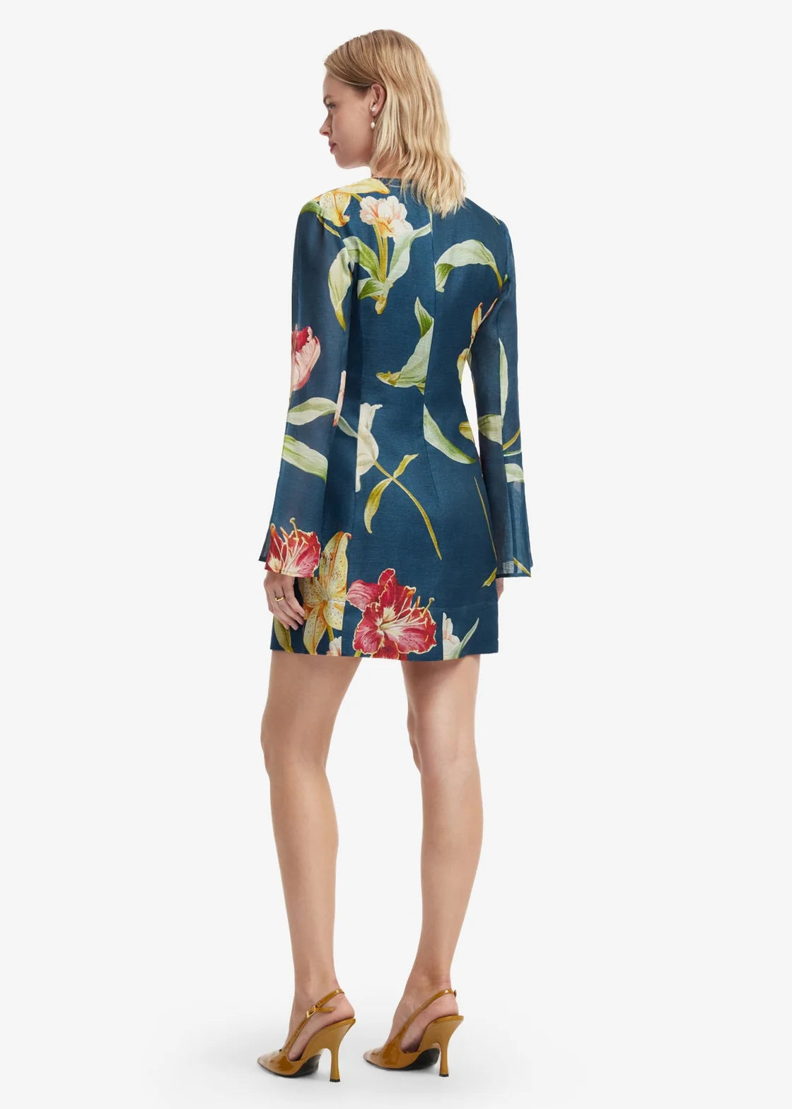 person wearing leo lin womens Suzanne Bell Sleeve Lily Print Mini Dress in Indigo