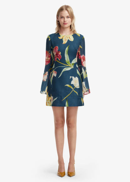 person wearing leo lin womens Suzanne Bell Sleeve Lily Print Mini Dress in Indigo