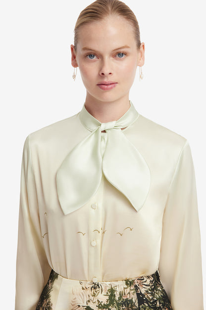 person wearing leo lin womens printed silk Cora Bow Blouse