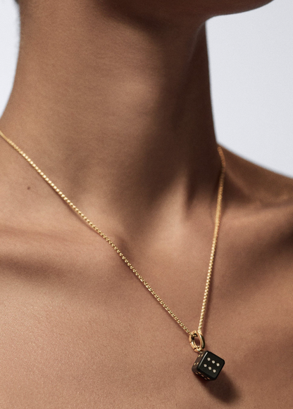 person wearing marie lichtenberg fine jewelry 18k yellow gold Ebony Dado Pendant 11mm necklace