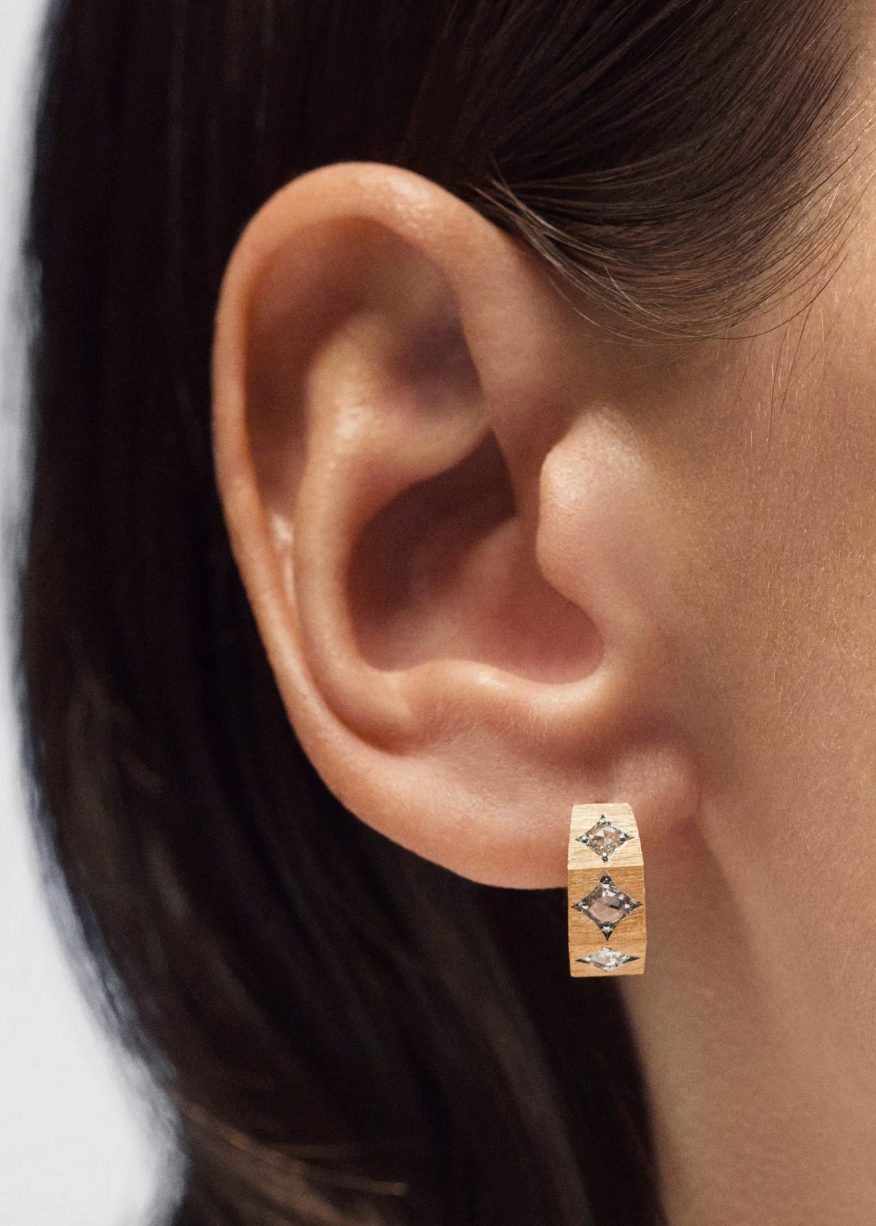 person wearing marie lichtenberg fine jewelry 18k yellow gold Ecrou Coco Diamond Earring Medium hoop